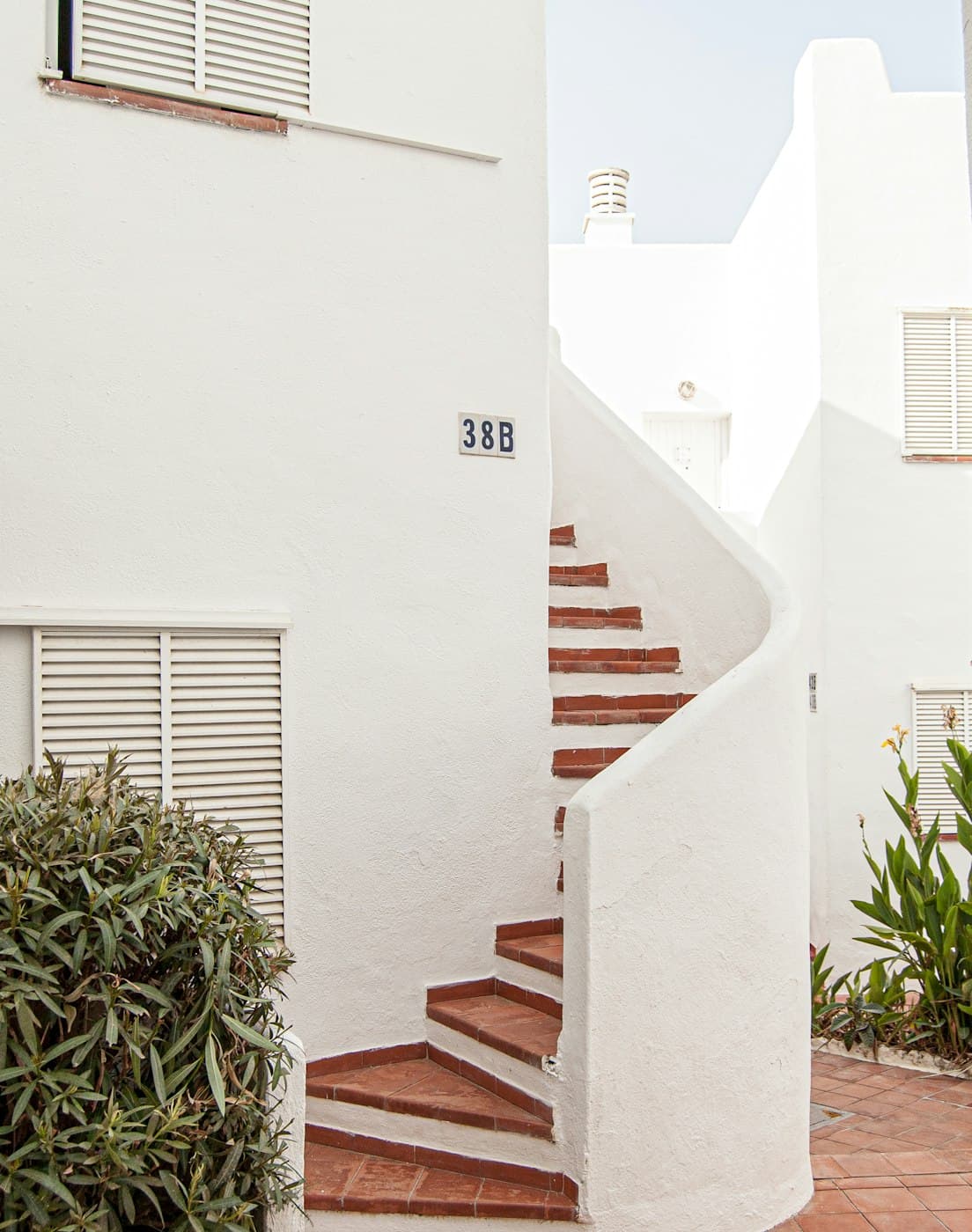White staircase between Mediterranean houses